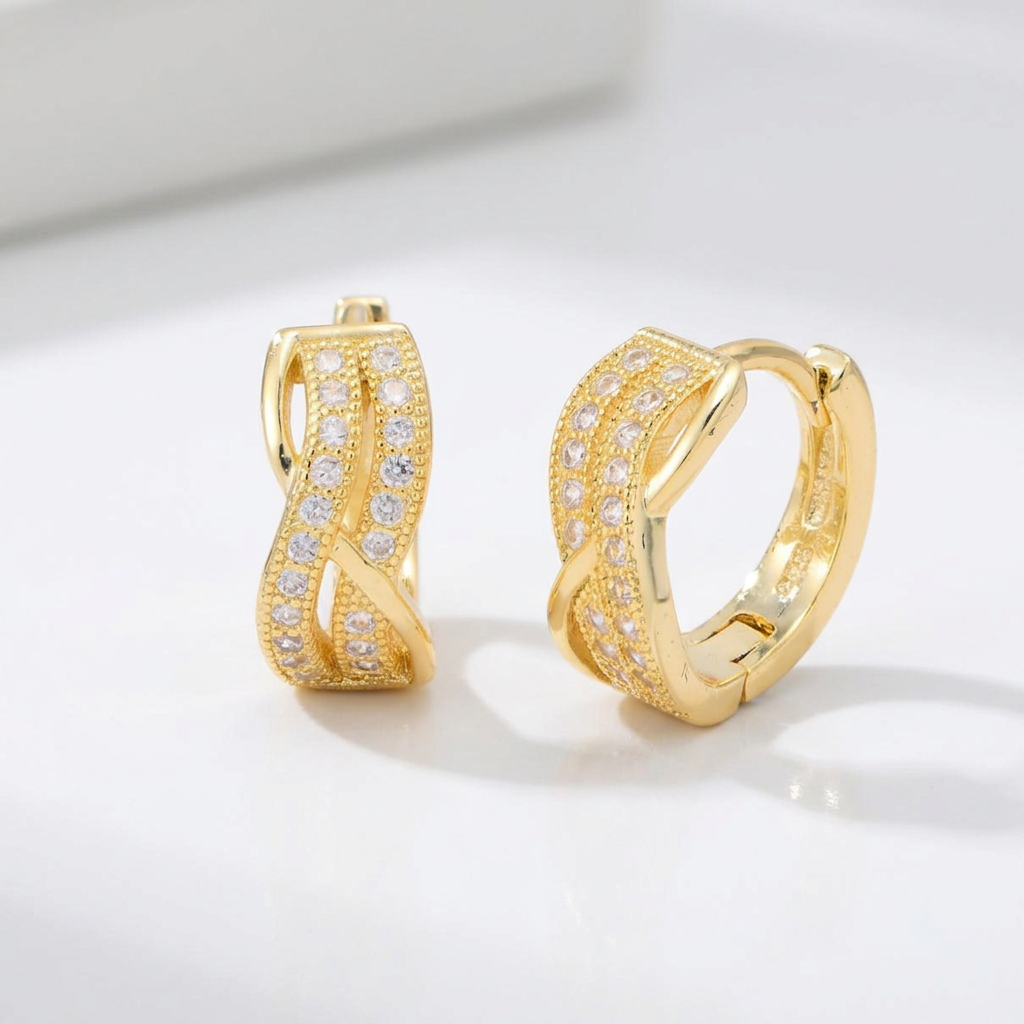 AI-generated Crisscross Pavé Huggies pair on a pearl-white background